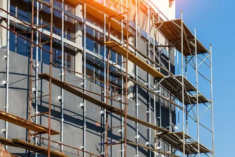 Extensive scaffolding providing platforms for work in progress on a new apart 스톡 사진