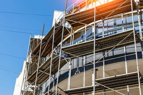 Extensive scaffolding providing platforms for work in progress on a new apart Stock Photos