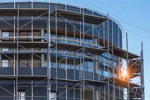 Extensive scaffolding providing platforms for work in progress on a new apart Stock Photos