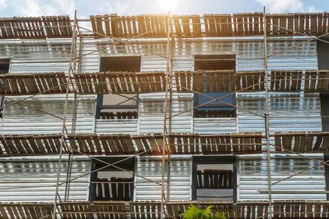 Extensive scaffolding providing platforms for work in progress on a new apart Stock Photos