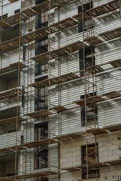 Extensive scaffolding providing platforms for work in progress on a new apart Stock Photos