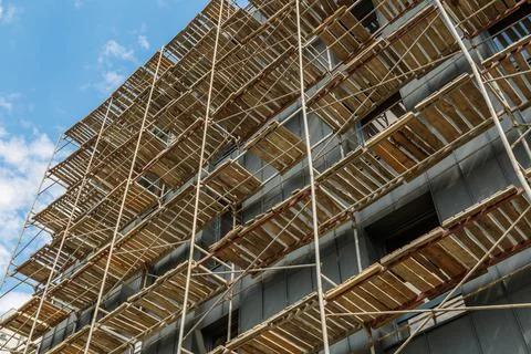 Extensive scaffolding providing platforms for work in progress on a new apart Stock Photos
