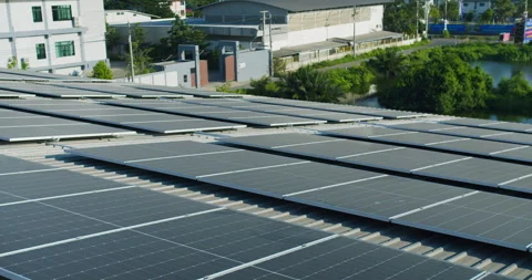 Extensive solar panel array is harnessing renewable energy on a commercial facto Stock-Footage 330256376