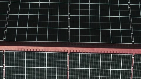 Extensive Solar Panel Array on the Metal Roof of a Large Factory Stock Footage 297902879