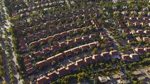 Extensive top-down aerial shot of red-roofed houses in the San Carlos de Stock Footage 332564697