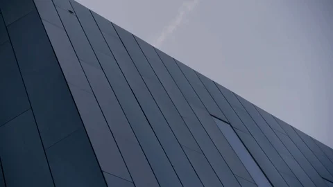 Exterior Black mirrored building high tech pan to right Stock Footage 89944844