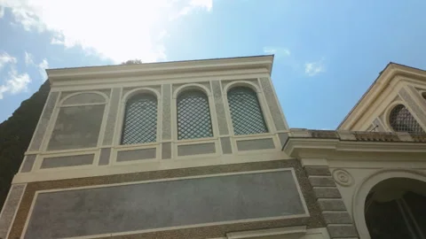 Exterior of classical Roman building with arched windows and patterned facade Stock Footage 313278945