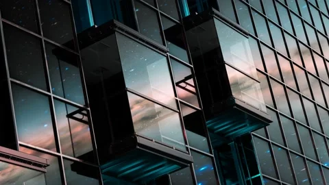 Exterior elevator cabins on a skyscraper glass facade during sunset. 4KHD Stock Footage 201124837