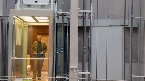 Exterior elevators carrying people. Fast motion Stock Footage 115481154