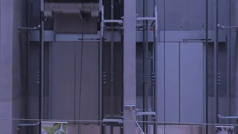 Exterior elevators carrying people. Fast motion Stock Footage 115502035