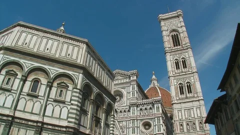 The exterior facade of the baptistry and facade of the Florence Duomo Stock Footage 74808894