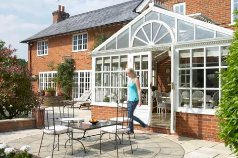 Exterior Of House With Conservatory And Patio Stock Photos