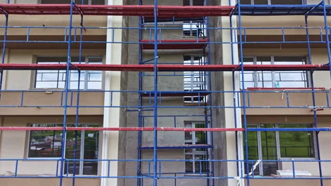 Exterior improvement project. Building facade renewal initiative. Comprehensive Stock Footage 340150991