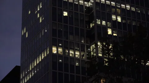 Exterior of office with lit windows at night 4k Video stock 55881753