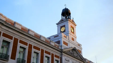 Exterior of an old clock tower with bells against blue sky in Madrid. Spain. 4K Stock-Footage 128027305