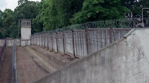 Exterior perimeter wall corner with searchlight at correctional facility in Stock Footage 344355242