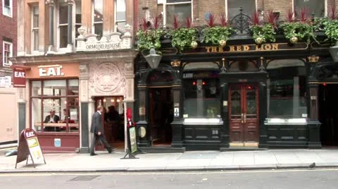 Exterior of pub and corner cafe Stock Footage