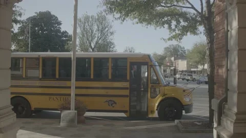 Exterior School Bus Drop 2 Stock Footage 143199709