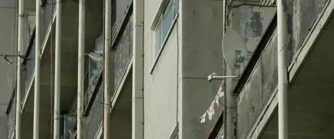 EXTERIOR - ST GEORGES FLAGS ON BLOCK OF FLATS BALCONY Stock Footage 141599668