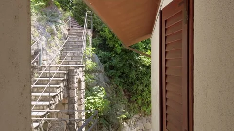 Exterior Staircase Climbing Up a Rock Face Stock Footage 338233553