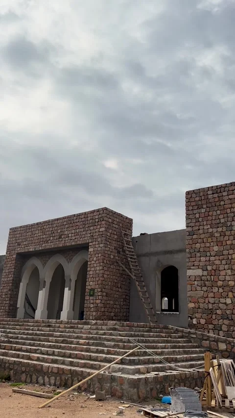 Exterior of Unfinished Stone Mosque Stock Footage 338264227