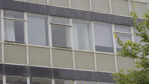 Exterior view of dilapidated office block windows Stock Footage 252018428
