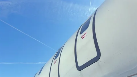 Exterior View of an Emergency Exit Opening From Inside in a Medium Size Jet Stock Footage 336845895