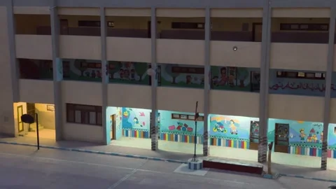 Exterior View of an Empty School Building with Colorful Murals in Egypt at Dusk Stock-Footage 311919051