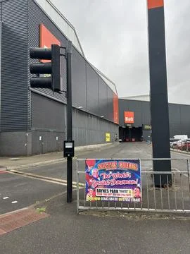 Exterior View Of Large Retail Complex With B and Q Signage And Circus Poster Stock Photos