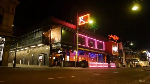 Exterior view of nightclub at night in Hindley Street, Adelaide, Australia Stock Footage
