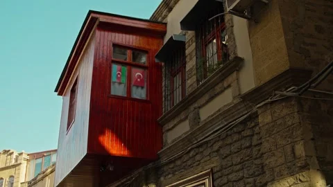 Exterior View of Old Building with Flags in Window Stock Footage 338244521
