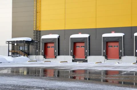 Exterior view of the warehouse in winter. Loading docks. Stock Photos