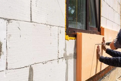 Exterior wall foam insulation, mounting panels, facade waterproofing, build.. Stock Photos