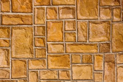 External brown stone wall background Stock Photos