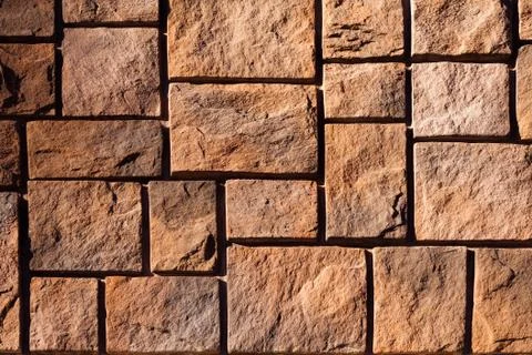 External brown stone wall background Stock Photos