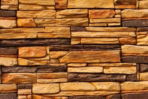 External brown stone wall background Stock Photos