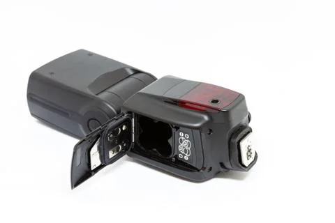 External on-camera flash with open battery compartment Stock Photos