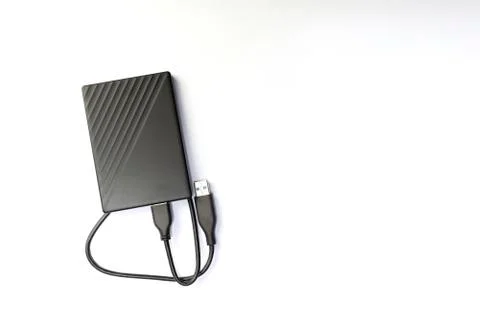 External compact SSD-drive with USB cable, top view with copyspace Stock Photos