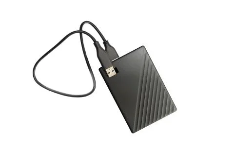 External compact SSD-drive with USB cable for writing, reading and storing da Stock Photos