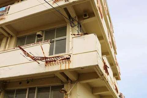External damage to the school building due to the tsunami. Stock Photos