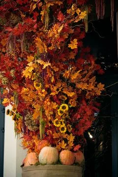 External facade decoration elements synthetic foliage orange color warm light Stock Photos