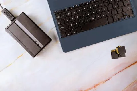 External hard disk and laptop computer transfer photos to SD cards Stock Photos