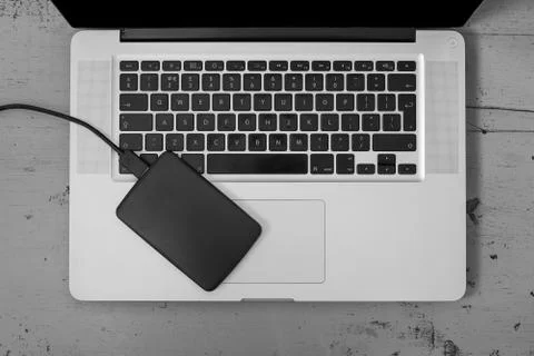 External Hard Disk Over Laptop Keyboard Stock Photos