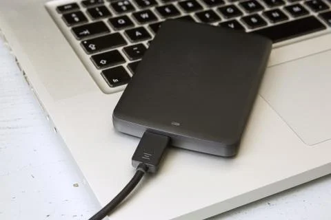 External Hard Disk Over Laptop Keyboard Stock Photos