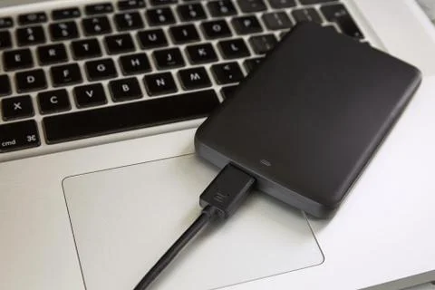 External Hard Disk Over Laptop Keyboard Stock Photos