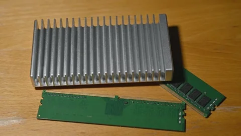 External Hard Drive and Desktop RAM Illuminated by Colorful LED Light Stock Footage 344954155