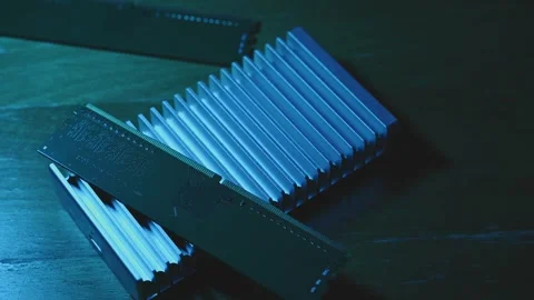 External Hard Drive and Desktop RAM Illuminated by Colorful LED Light Stock Footage 344954234
