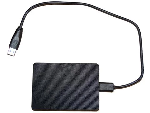 External hard drive with cable isolated on white 库存照片