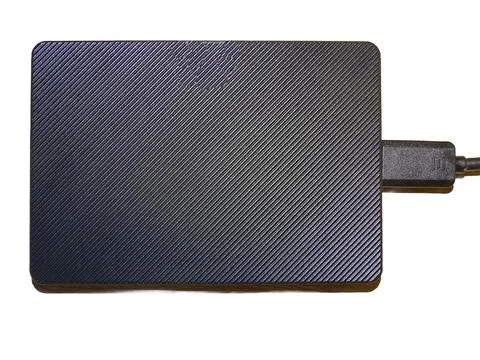 External hard drive with cable isolated on white Fotos Stock