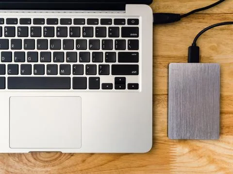 External hard drive connected to laptop computer Stock Photos